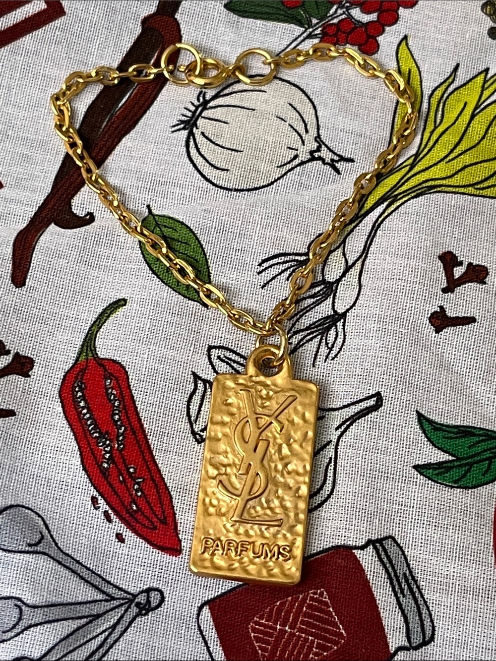 Yves Saint Laurent Gold Hammered Logo Pendant Chain Bracelet